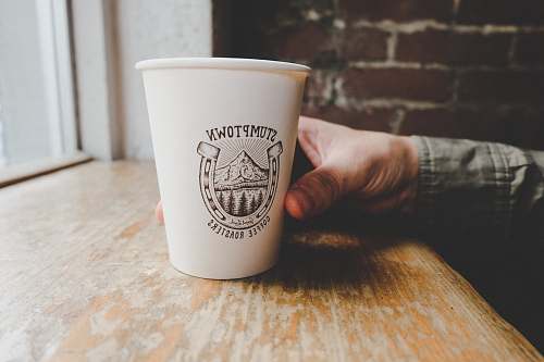 coffee cup person holding white disposable paper cup portland